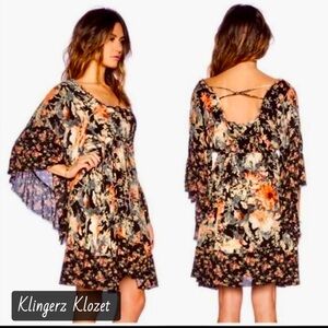 Free people, heart of gold Bohemian, floral, long bell sleeve mini dress.